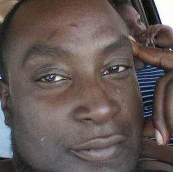 &#13;
Relatives of Keith Lamont Scott said he was sitting in a car with a book &#13;