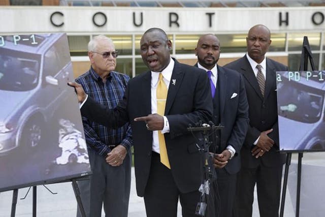 Attorney Benjamin Crump, center, one of the attorneys for Terence Crutcher's family, speaks about Mr Crutcher during a news conference about the shooting death of Crutcher Tuesday, 20 September, 2016 in Tulsa, Oklahoma