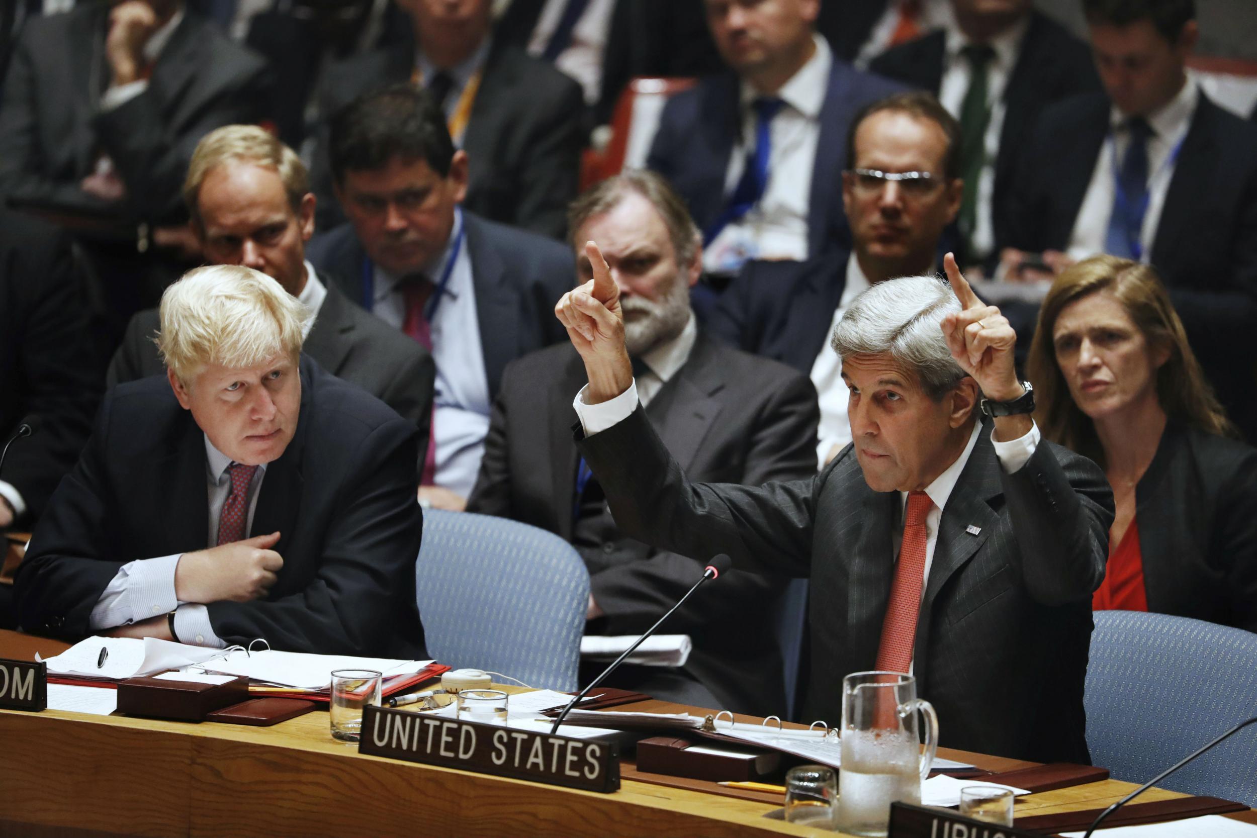 Kerry speaking in New York as UK Foreign Secretary Boris Johnson looks on