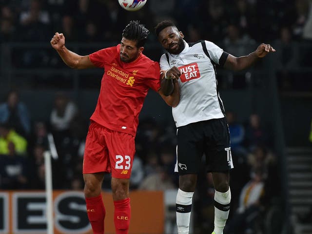 Emre Can jumps for the ball with Darren Bent at Derby County