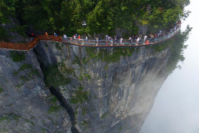 The Coiling Dragon Cliff Walkway opened in August, offering the chance to walk a narrow, glass path around Hunan's Tianmen Mountain