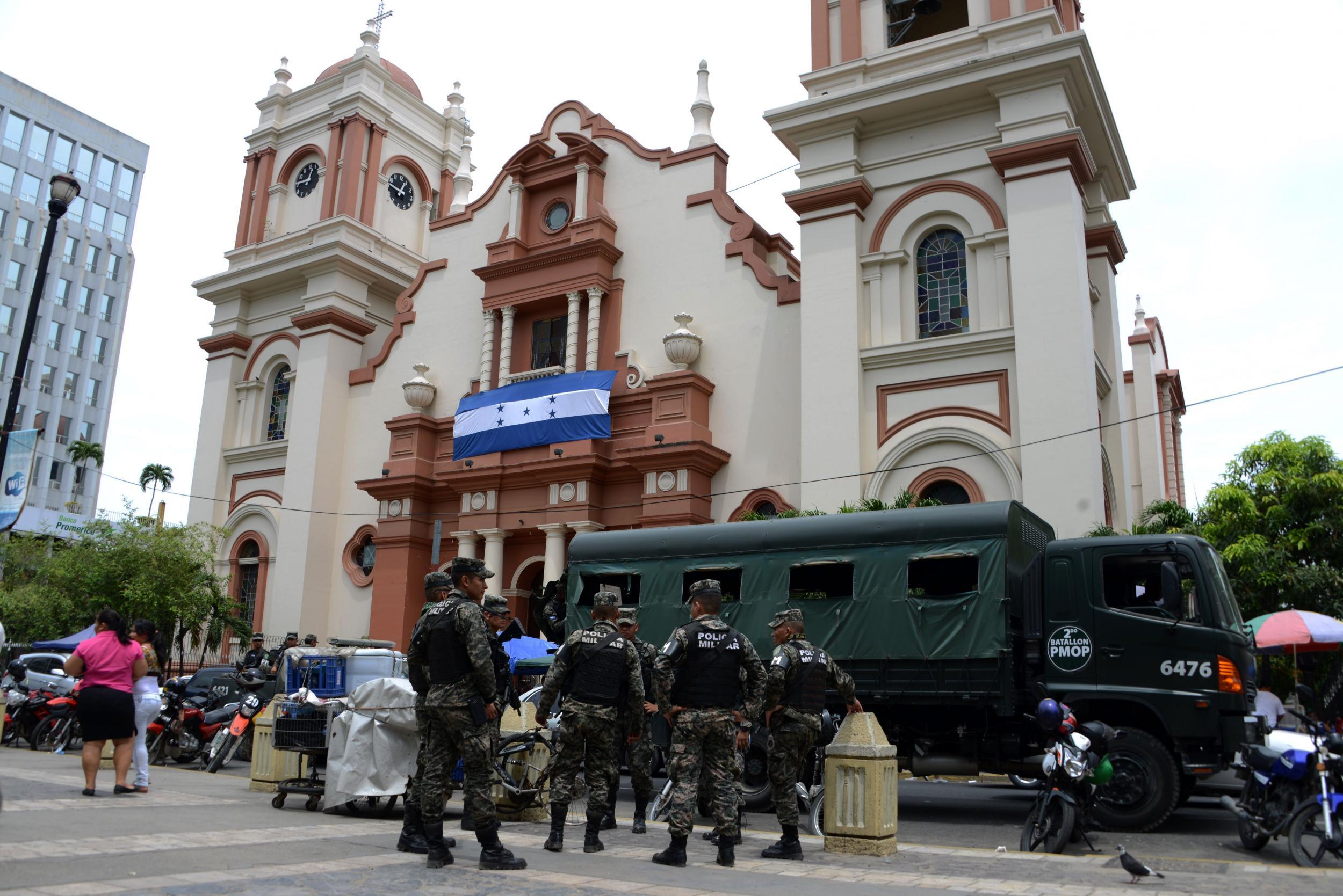 Military police guarding the cathedral in San Pedro Sula