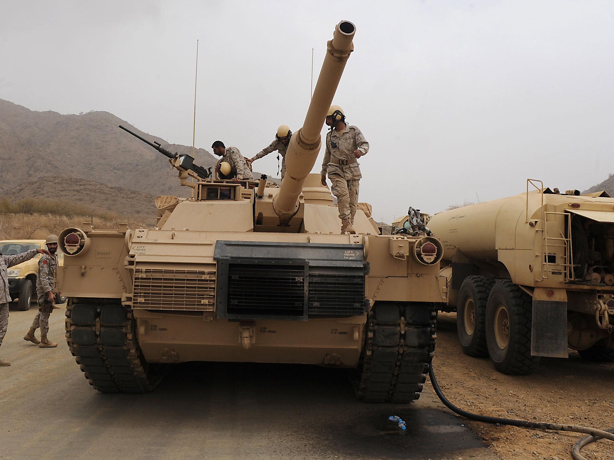 Saudi troops pictured atop their tank on the Saudi Arabian-Yemeni border