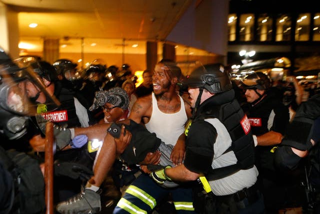 Seriously wounded man carried into Omni Hotel during second day of Charlotte protests <em>Brian Blanco/Getty Images</em>