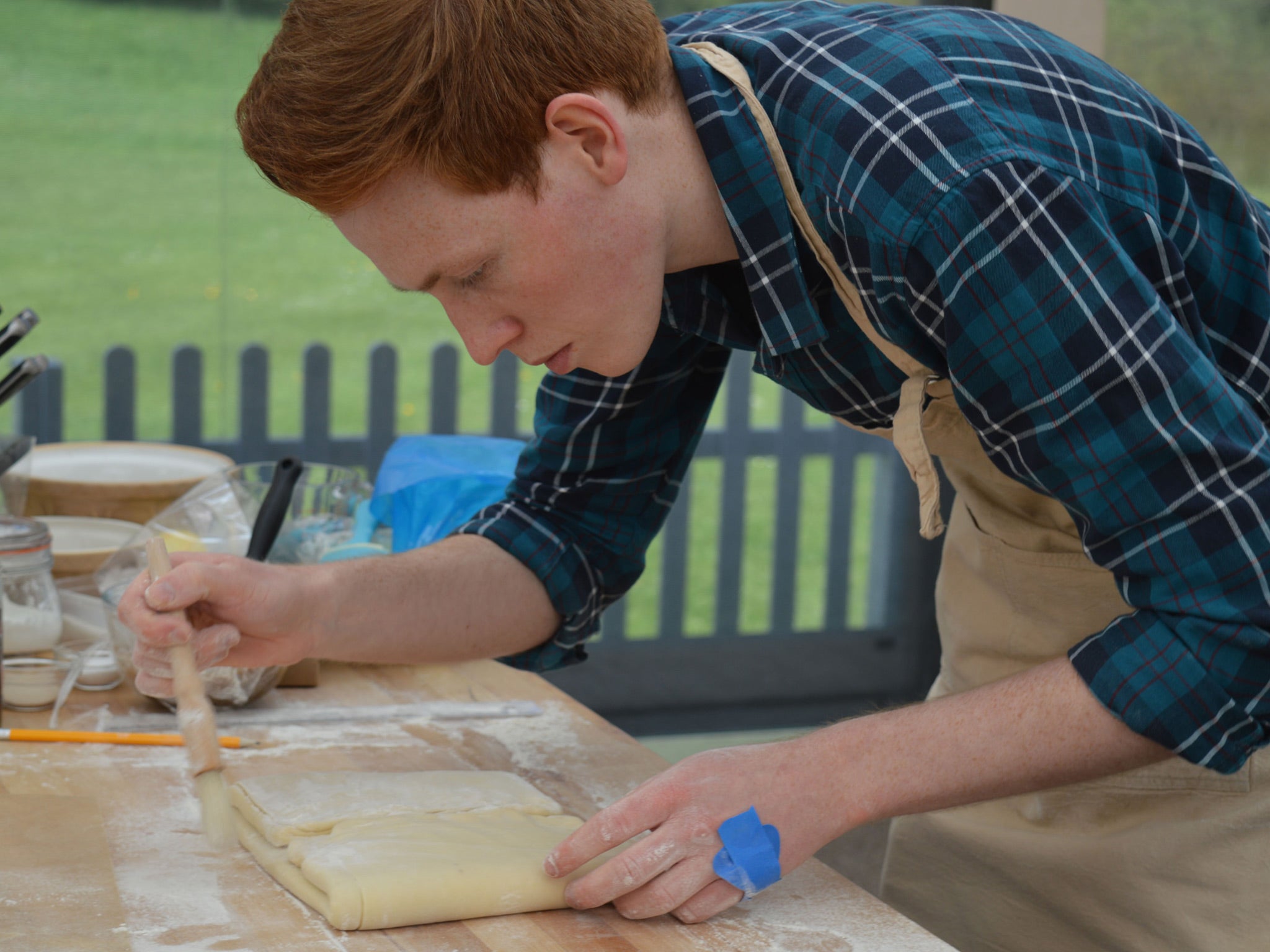 Engineering in action: Andrew working on his precise book folds.