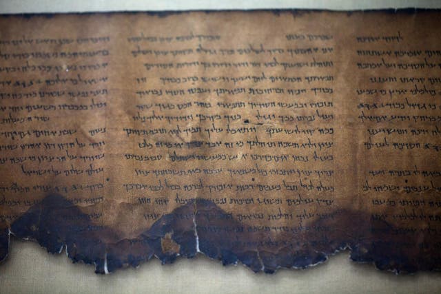A fragment of the 2000-year-old Dead Sea scrolls is laid out at a laboratory on December 18, 2012 in Jerusalem, Israel