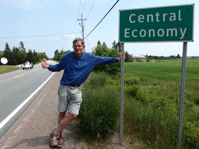Serial hitcher Simon Calder thumbing a ride in Central Economy, Nova Scotia, Canada