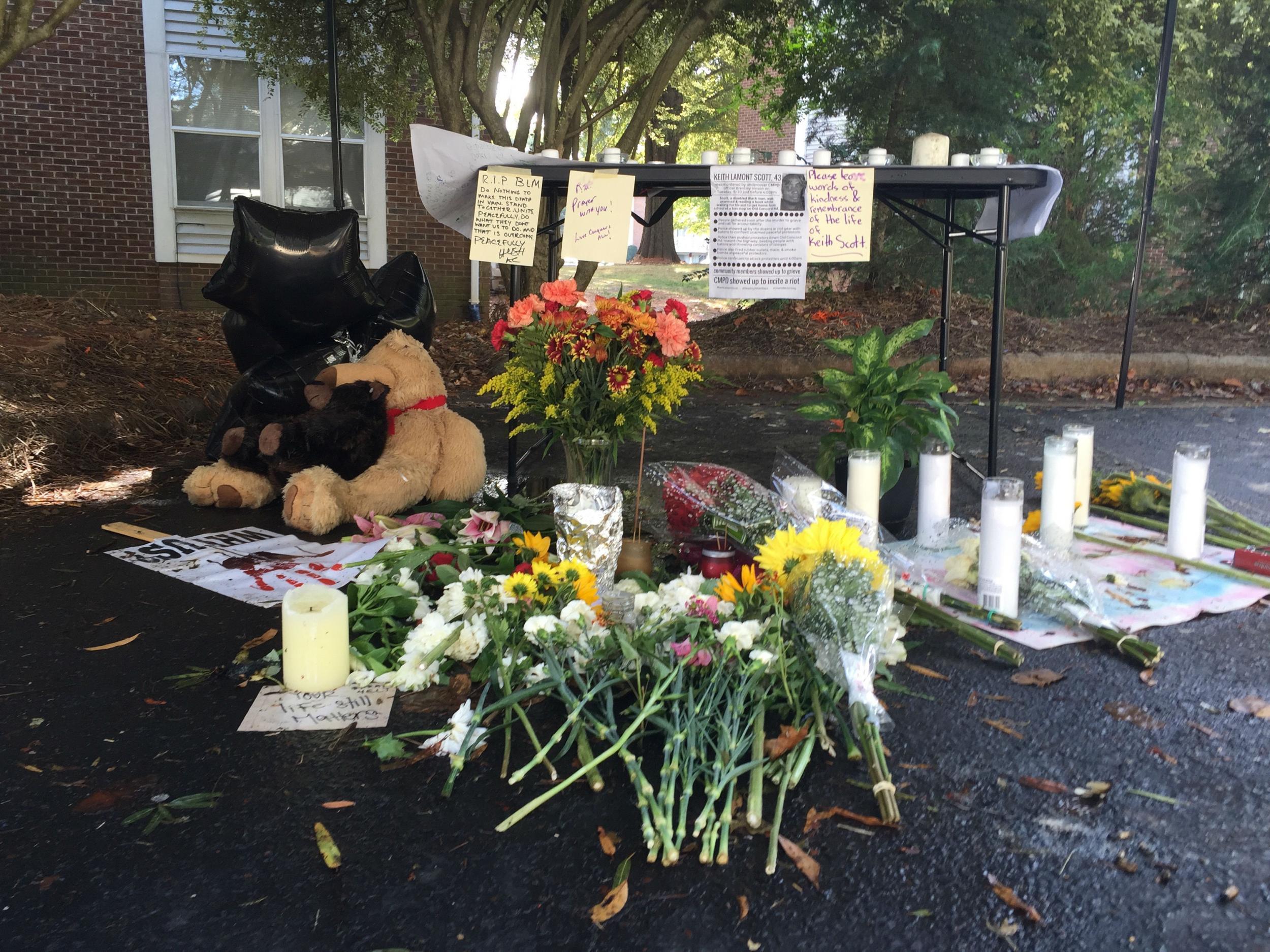 Friends set up a memorial where police killed Keith Lamont Scott