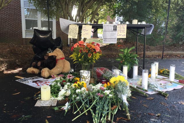 Friends set up a memorial where police killed Keith Lamont Scott