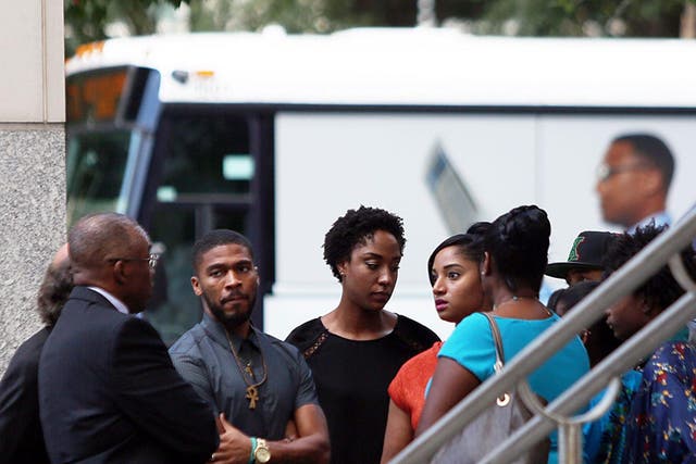 Members of Keith Lamont Scott's family gather outside the Mecklenburg County Courthouse