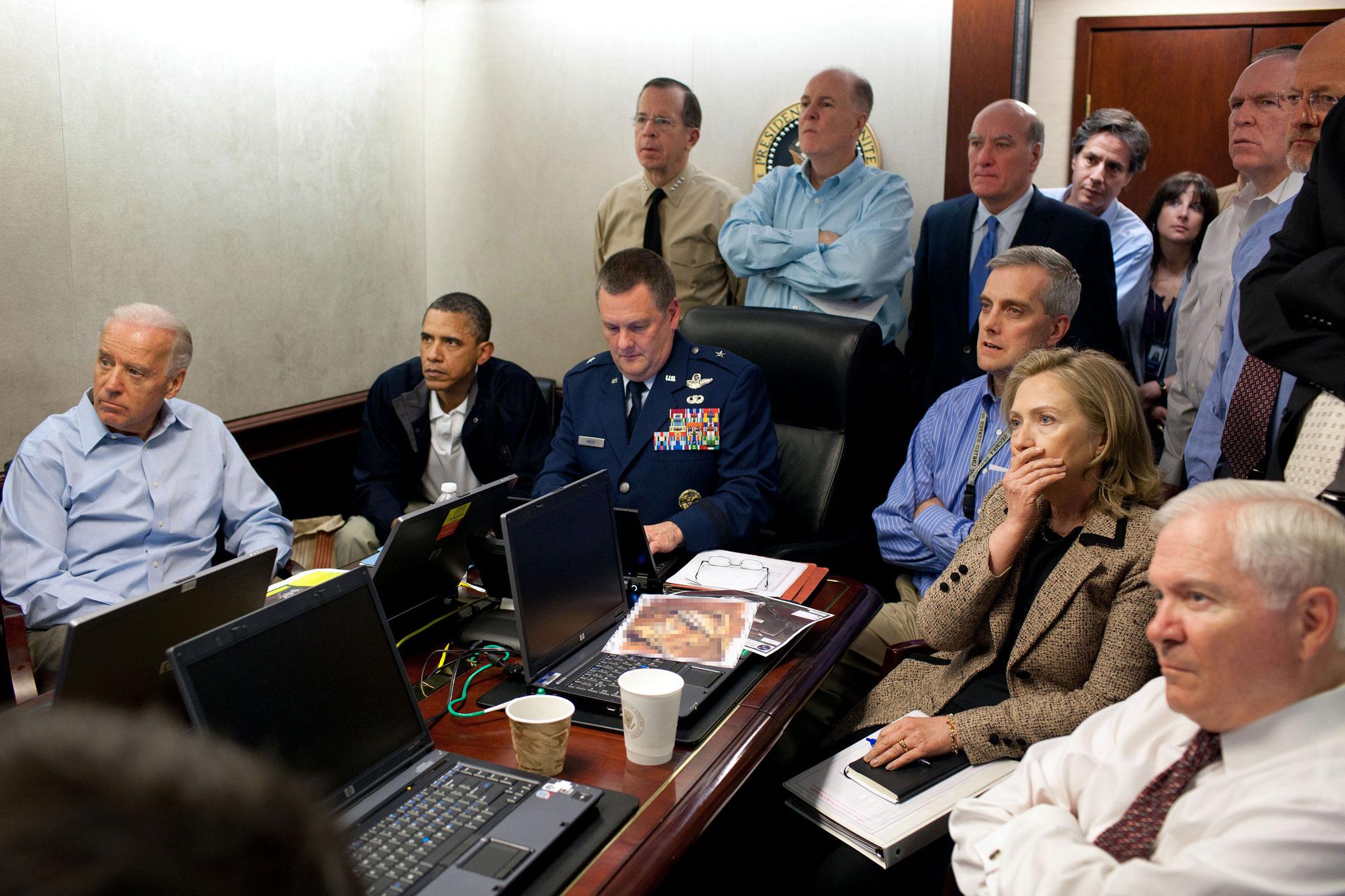Barack Obama and then-Secretary of State Hillary Clinton with US national security officials as soldiers carry out the raid that killed Osama Bin Laden