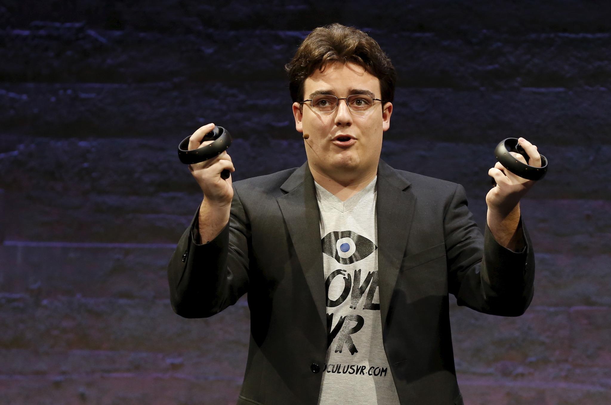 Oculus Founder Palmer Luckey displays an Oculus Touch input during an event in San Francisco, California June 11, 2015