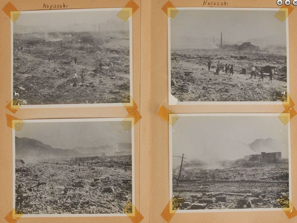 Photographs showing Nagasaki devastated by the atomic bomb on the pages of the photo album being auctioned by RR Auction