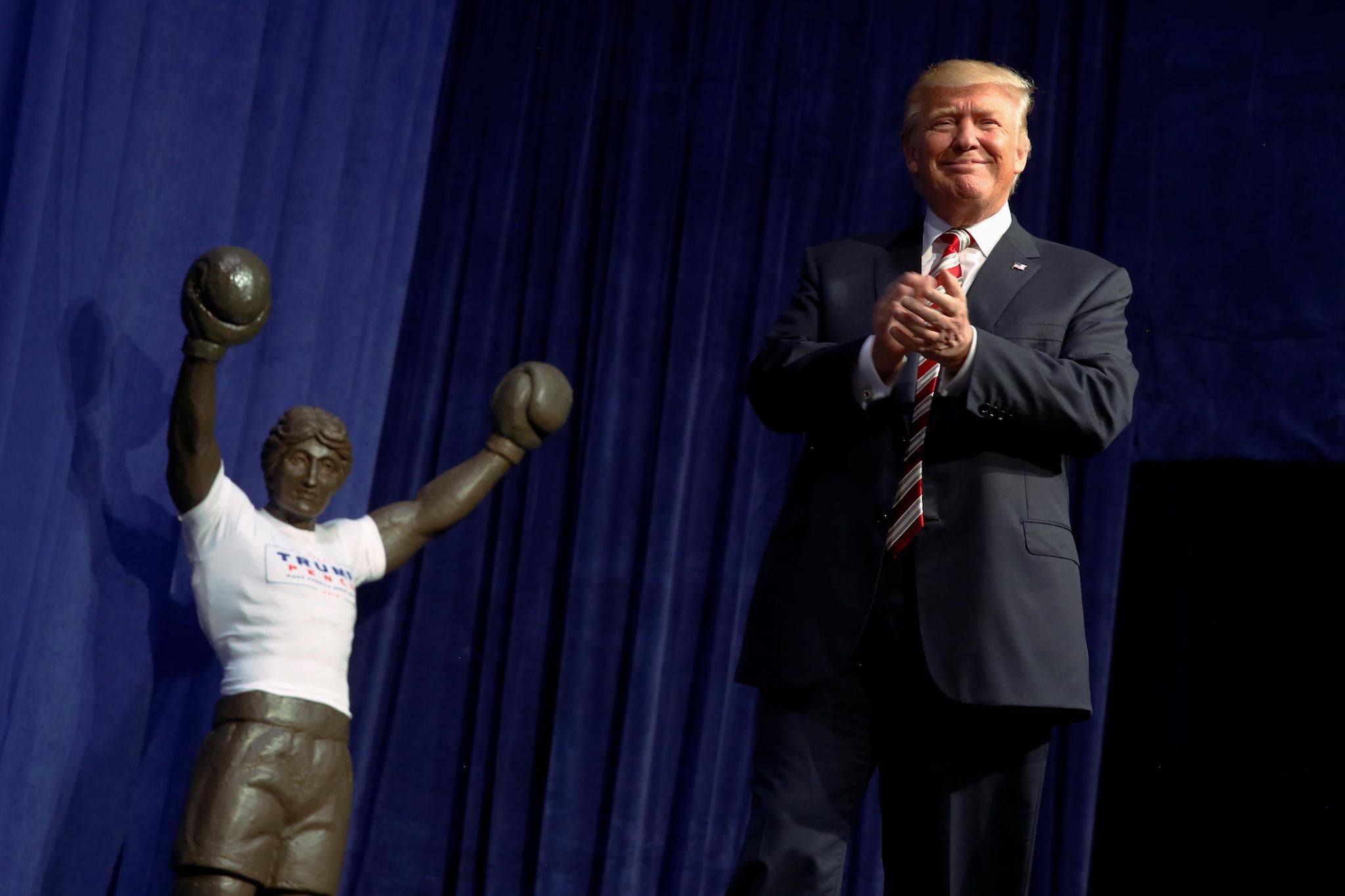 A statue of the movie boxer Rocky stands near the stage entrance as Republican presidential nominee Donald Trump holds a rally with supporters in Aston, Pennsylvania