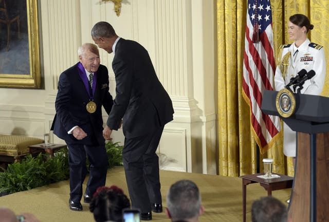 Barack Obama jokes with actor, comedian and writer Mel Brooks after presenting him with the National Medal of Arts during a ceremony in the East Room of the White House