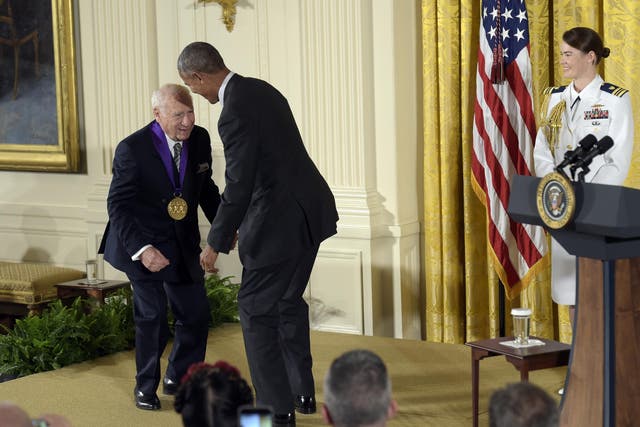 Barack Obama jokes with actor, comedian and writer Mel Brooks after presenting him with the National Medal of Arts during a ceremony in the East Room of the White House