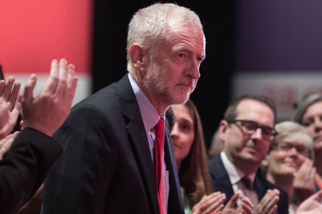 Labour leader Jeremy Corbyn is congratulated following his victory, after the announcement of the winner in the Labour leadership contest between him and Owen Smith at the ACC Liverpool.