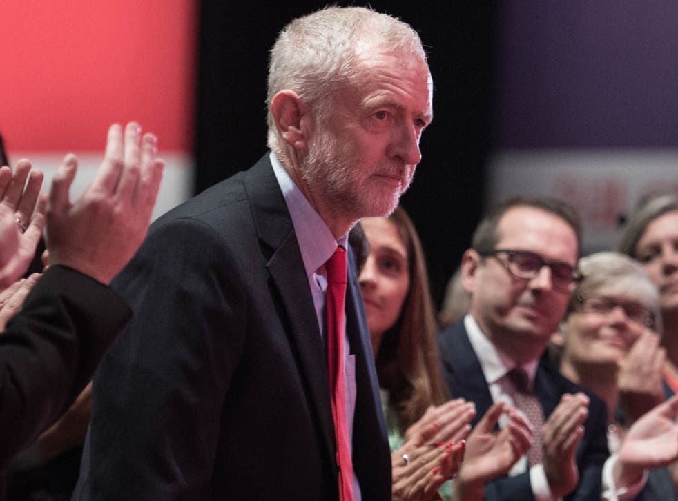 Labour leader Jeremy Corbyn is congratulated following his victory, after the announcement of the winner in the Labour leadership contest between him and Owen Smith at the ACC Liverpool.