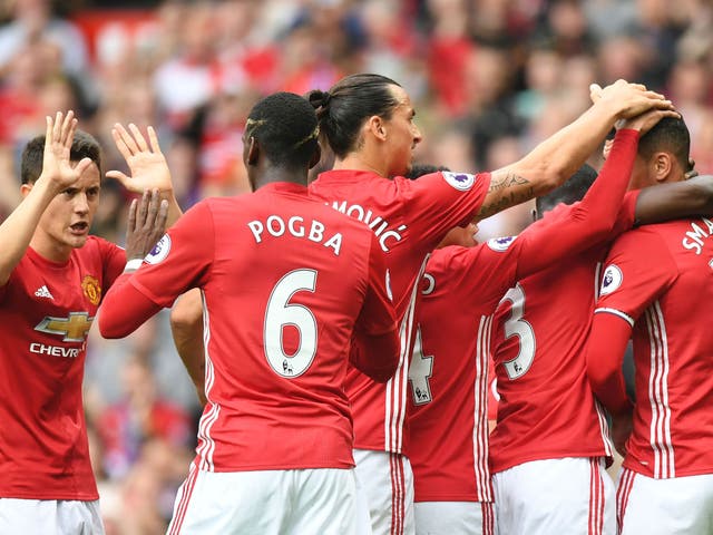 Manchester United celebrate their first goal courtesy of Chris Smalling