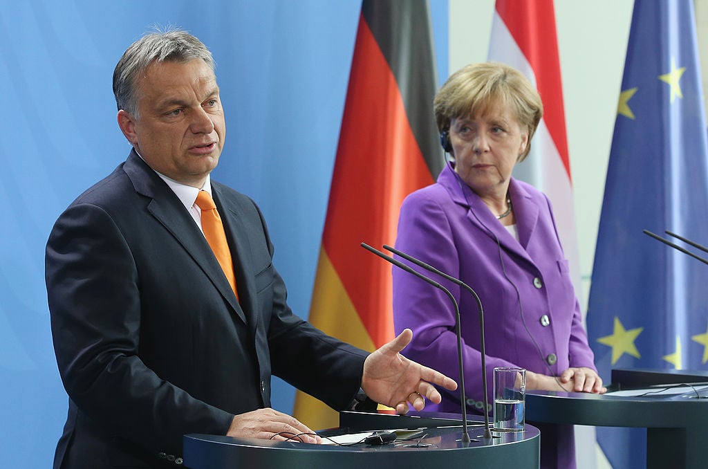 Viktor Orban, Hungary’s Prime Minister, with German Chancellor Angela Merkel (Getty)