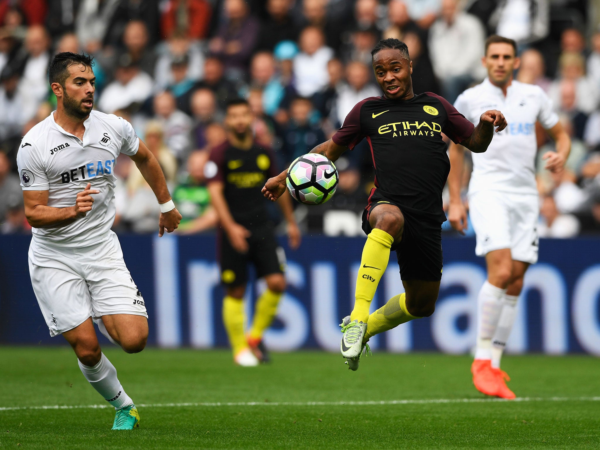 Raheem Sterling attempts to control the ball during Saturday's game against Swansea