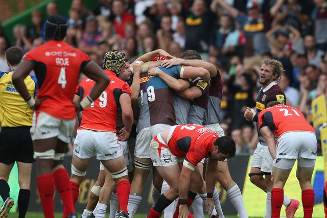 Harlequins celebrate their victory at the final whistle