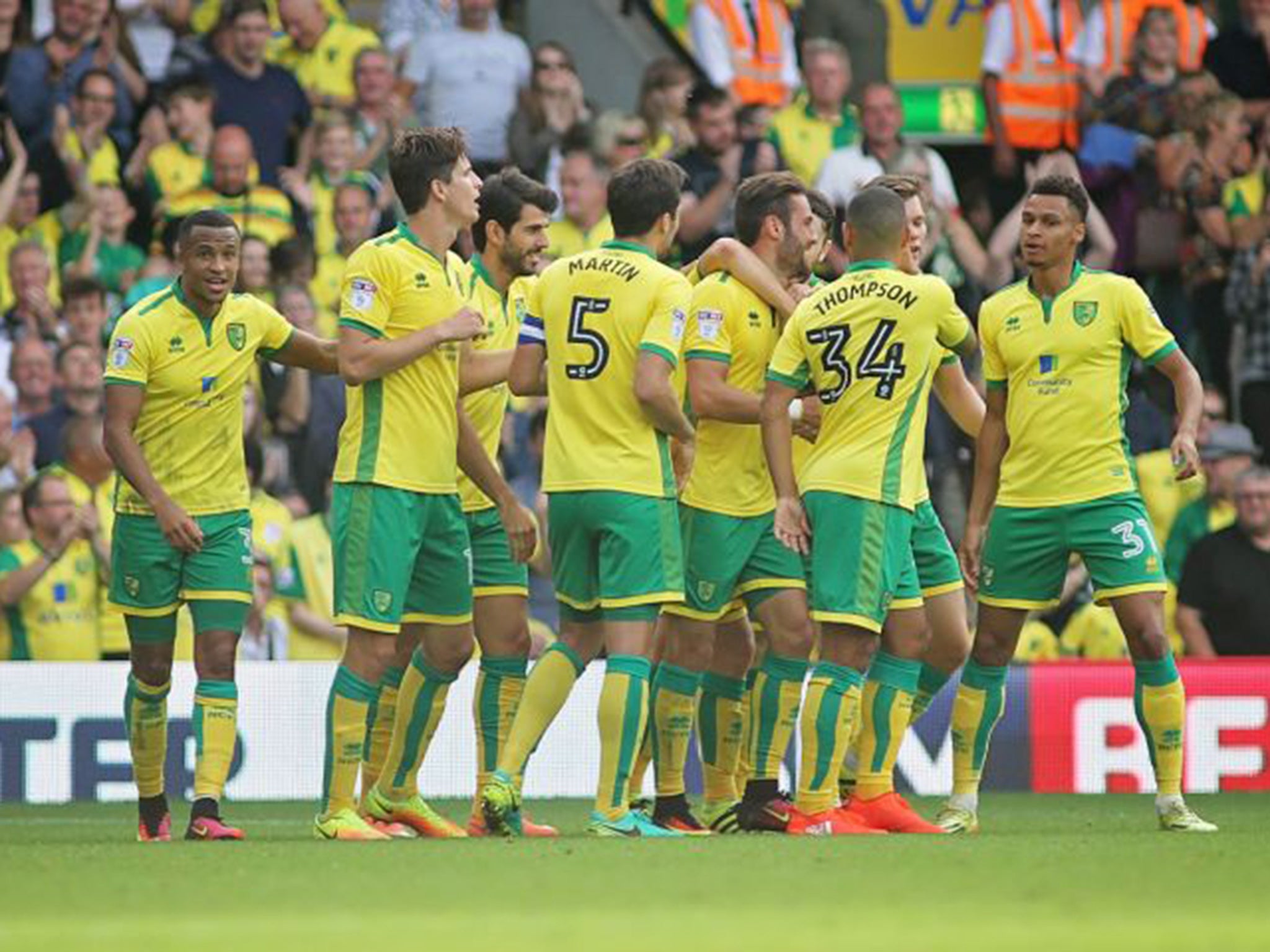 Norwich players congratulate Ivan Pinto on his goal