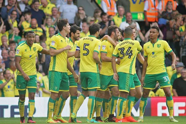 Norwich players congratulate Ivan Pinto on his goal