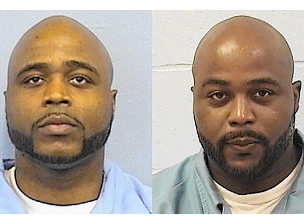 <p>Karl Smith, left, and identical brother Kevin Dugar  who was released on a bond from a Chicago jail on Wednesday </p>