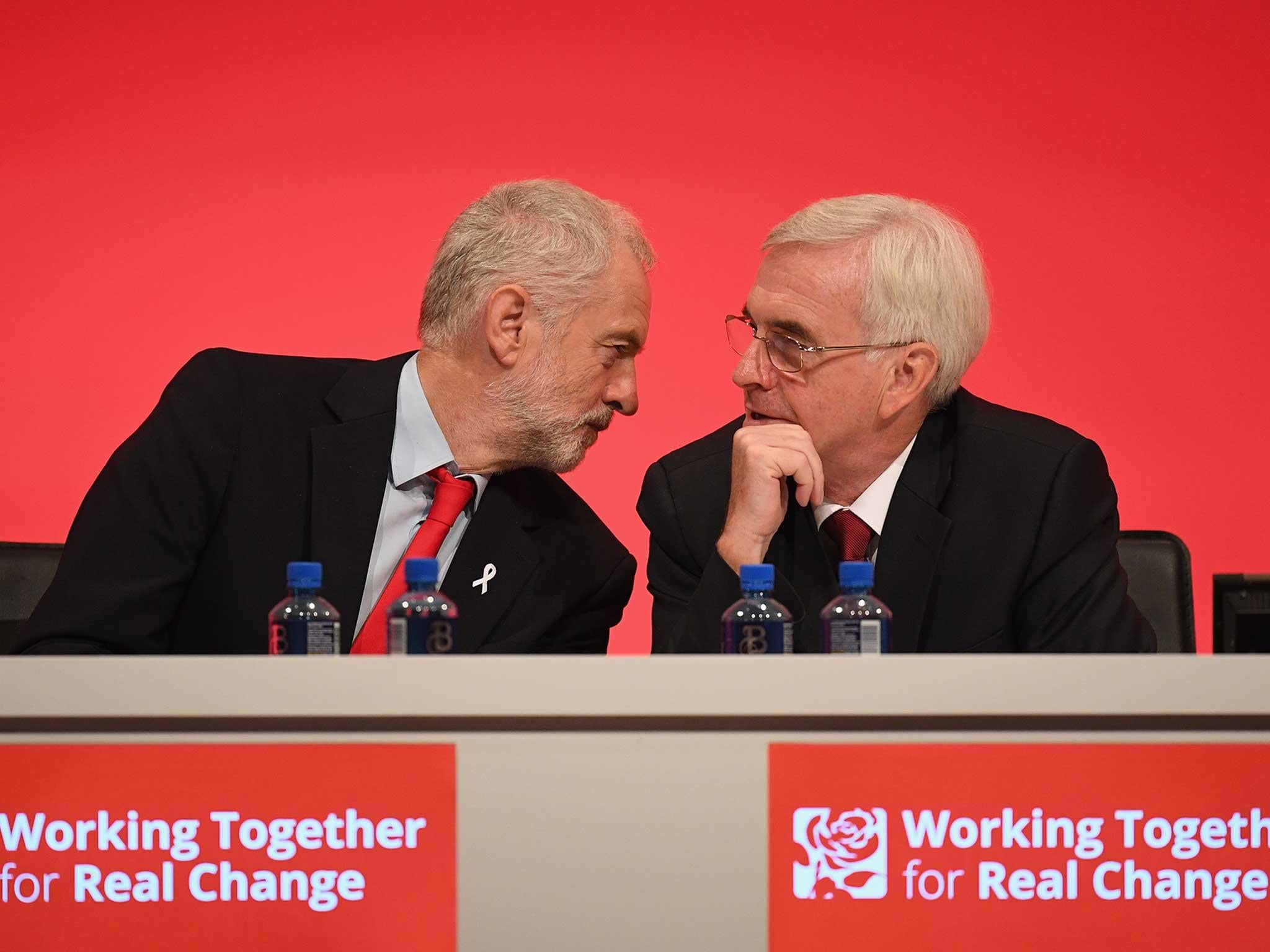 Labour Leader Jeremy Corbyn talks with Shadow Chancellor John McDonnell during the Labour Party Conference in Liverpool