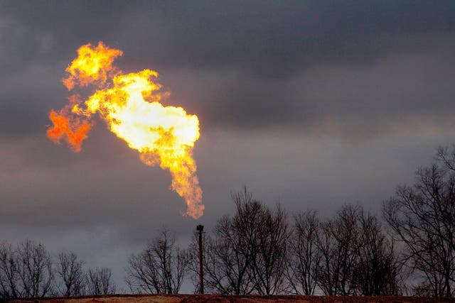 A gas flare burns at a fracking site in rural Pennsylvania. Some residents claim the process has polluted local land, air and water