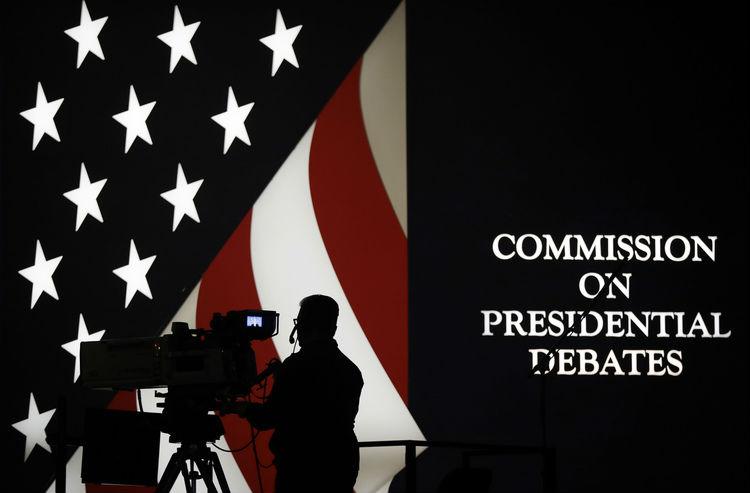 A TV cameraman setting up before the start of the debate