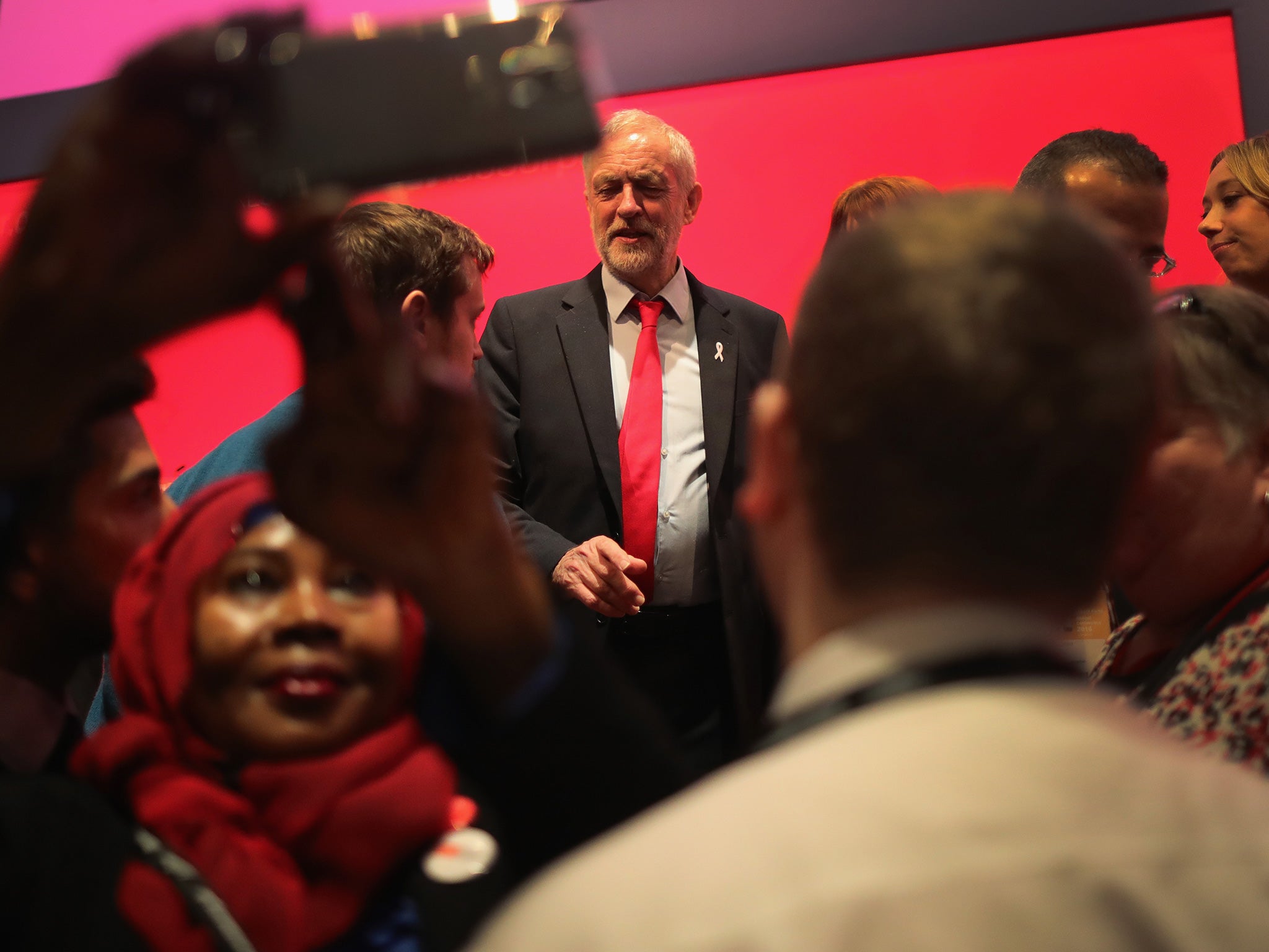 The Labour leader talks to delegates during the Labour Party conference yesterday