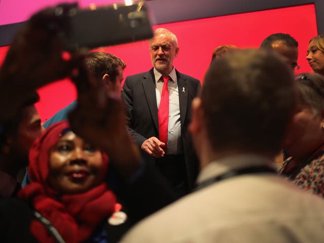 The Labour leader talks to delegates during the Labour Party conference yesterday