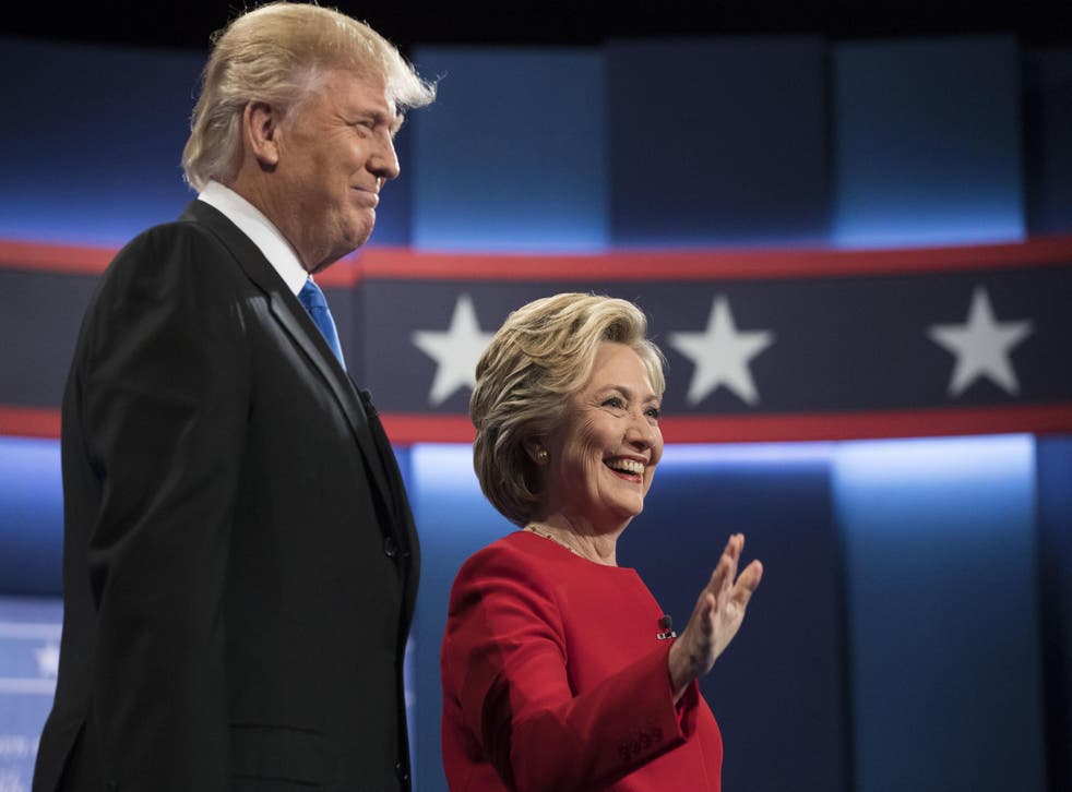 Democratic presidential nominee Hillary Clinton stands with Republican presidential nominee Donald Trump at the start of the presidential debate at Hofstra University in Hempstead, NY
