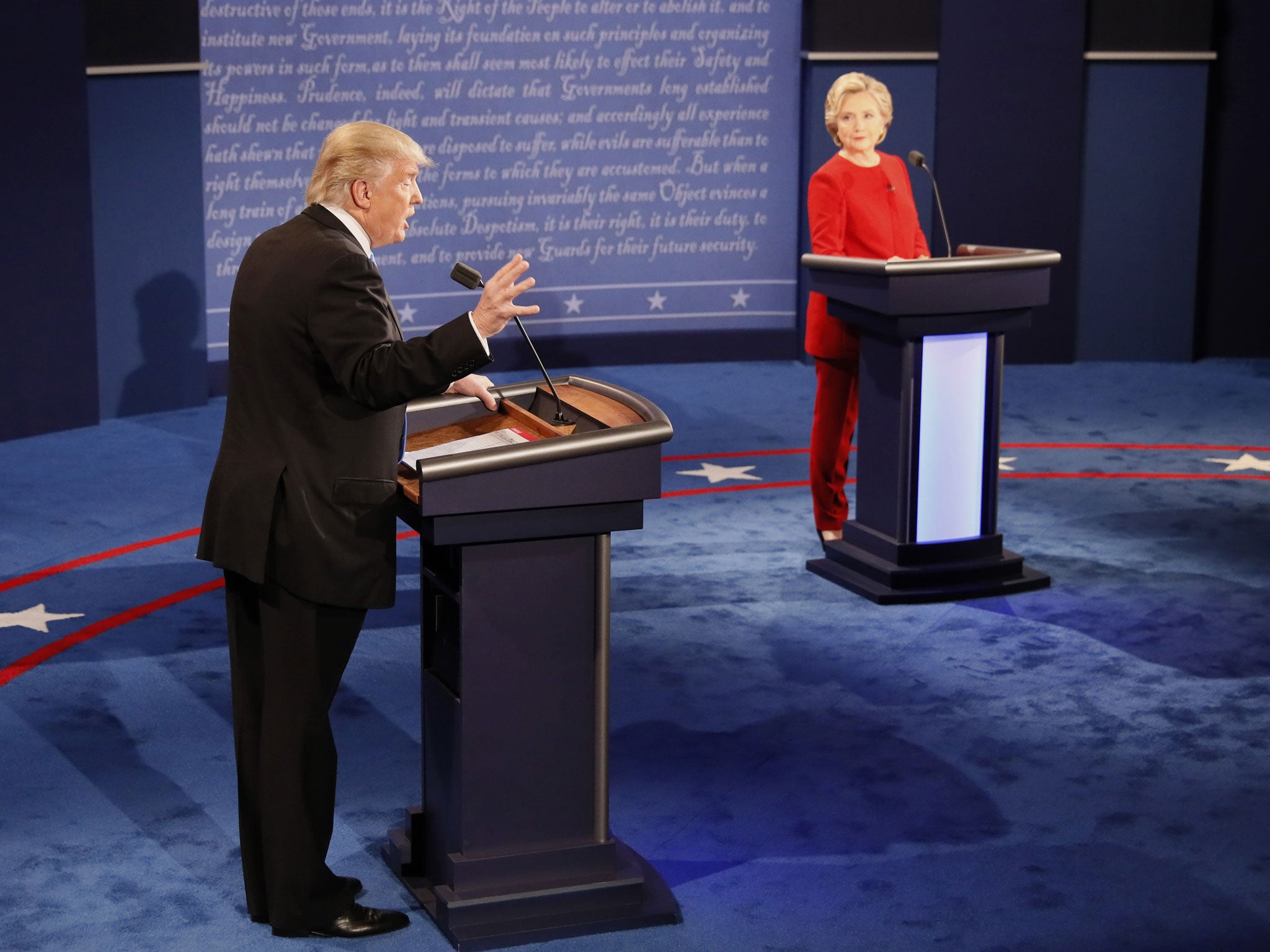 Republican U.S. presidential nominee Donald Trump speaks as Democratic U.S. presidential nominee Hillary Clinton listens during their first presidential debate at Hofstra University in Hempstead, New York, U.S., September 26, 2016