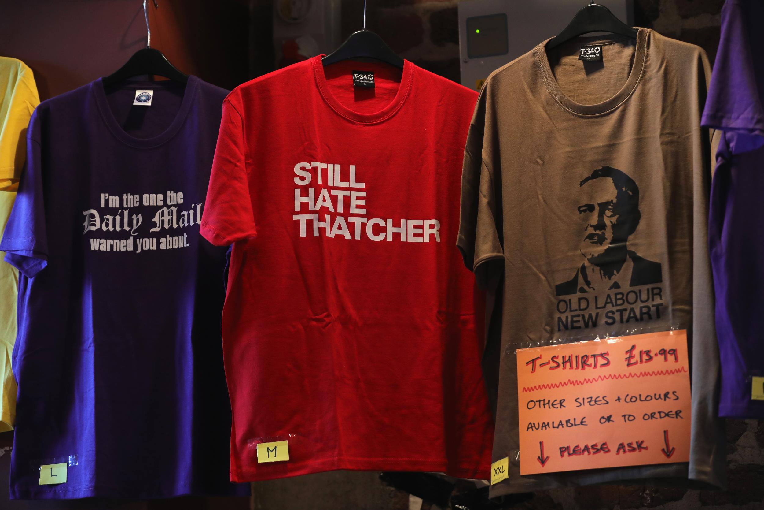 Political tee shirts are seen for sale as Momentum supporters gather at Liverpool's Black-E building