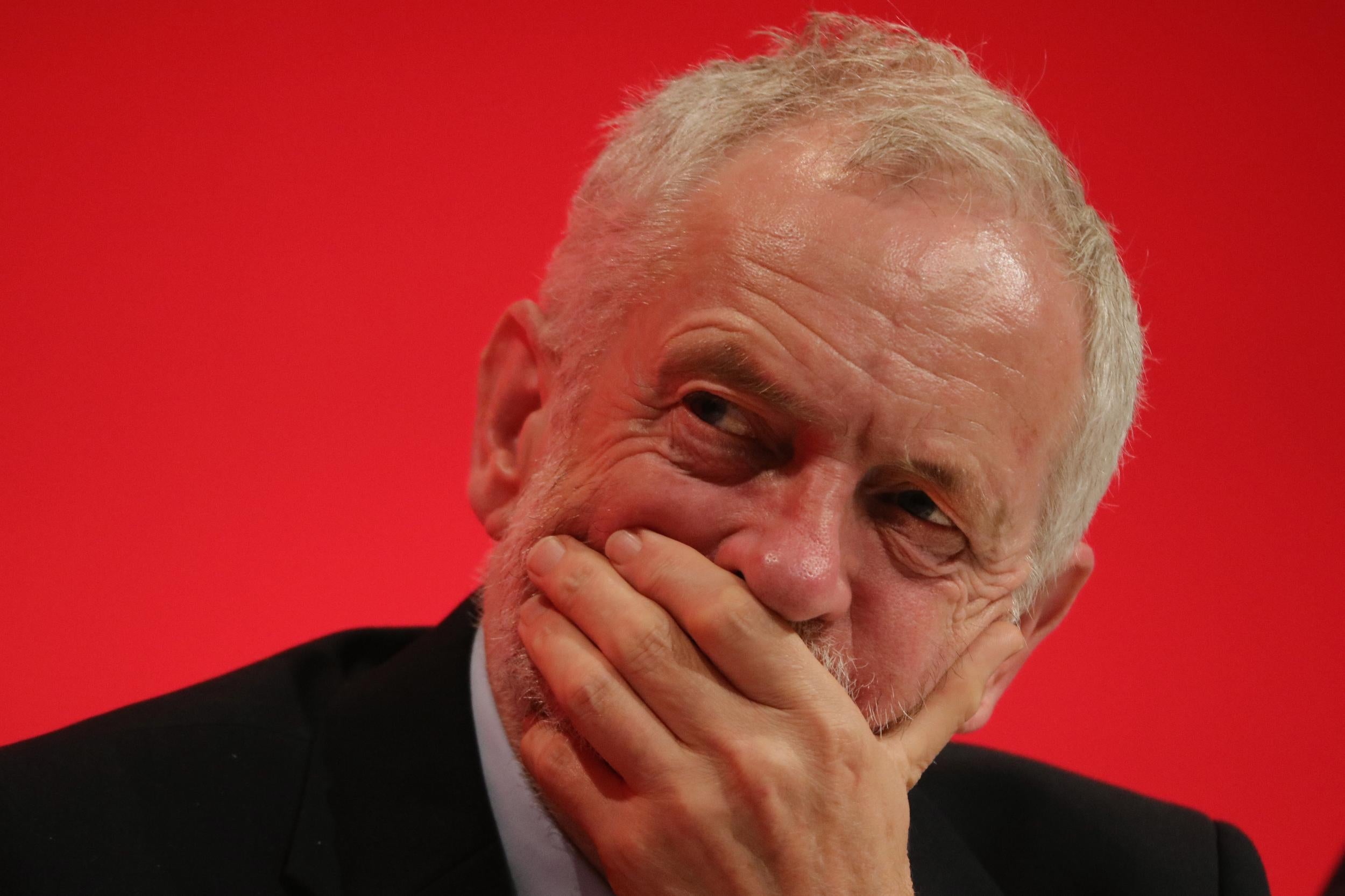 Jeremy Corbyn listens to speakers in the main hall on the second day of the Labour Party conference