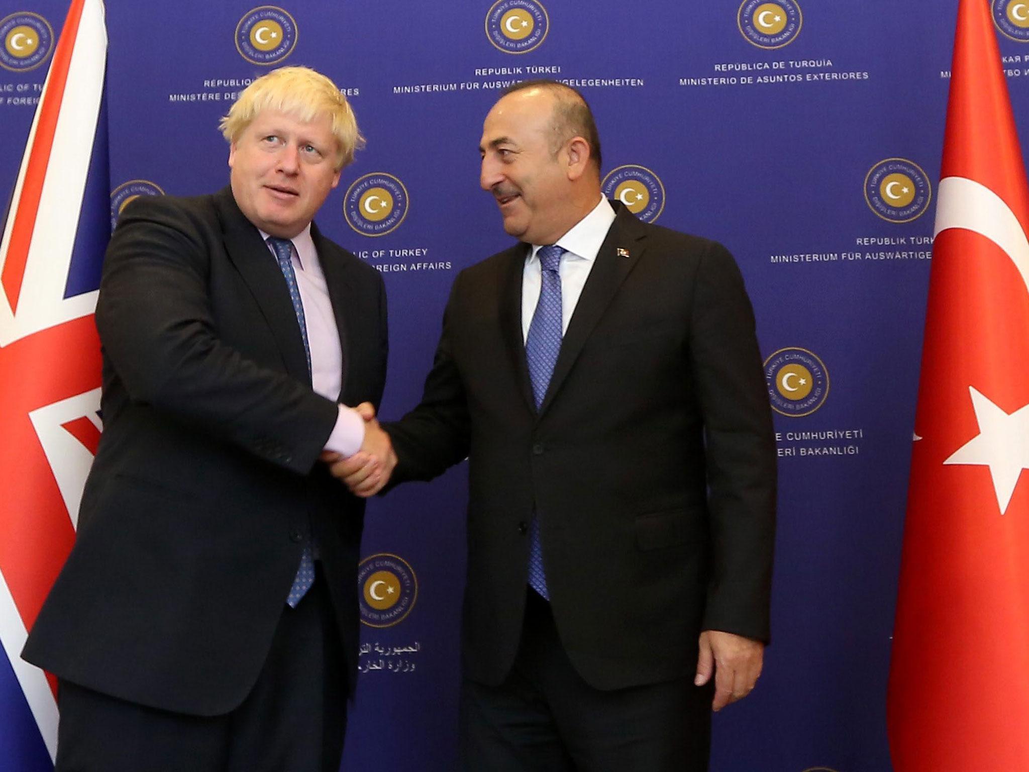 British Foreign Secretary Boris Johnson is welcomed by Turkish Foreign Minister Mevlut Cavusoglu in Ankara, Turkey, 27 September, 2016