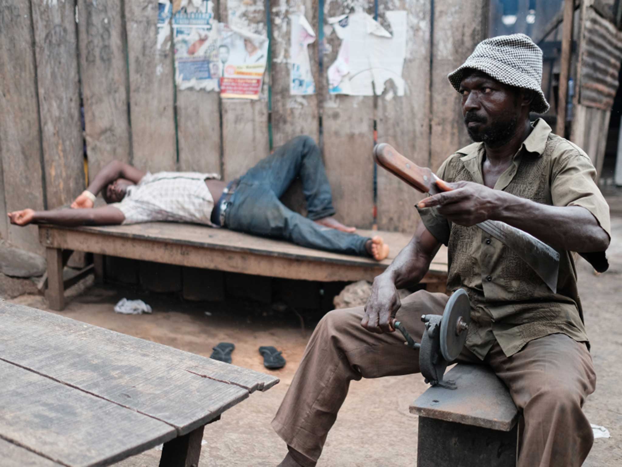 A roving knife sharpener sharpening a butcher’s machete