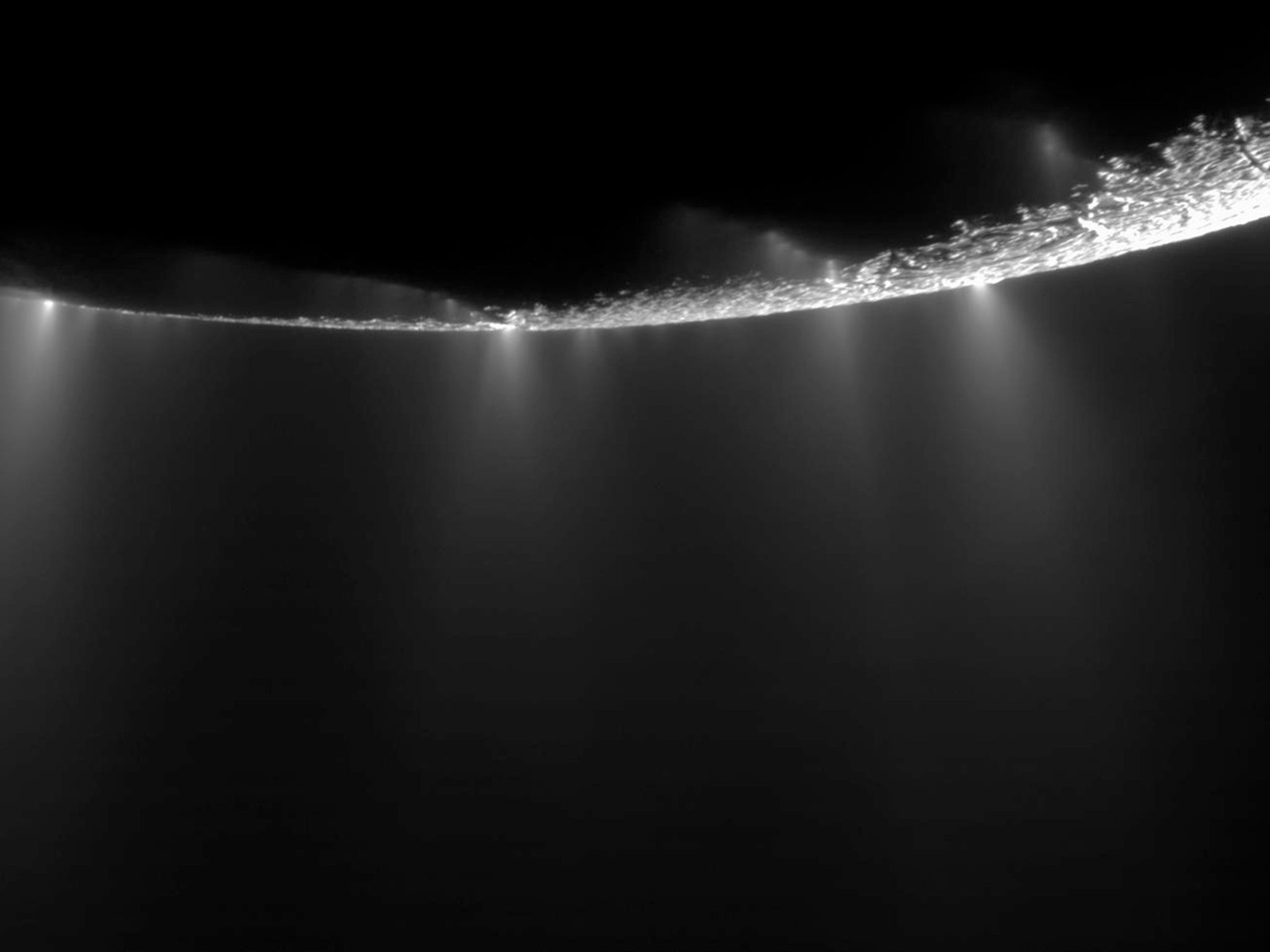 Jets erupting from cracks near the south pole of Enceladus