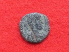 Ancient Roman coins found buried under ruins of Japanese castle leave archaeologists baffled