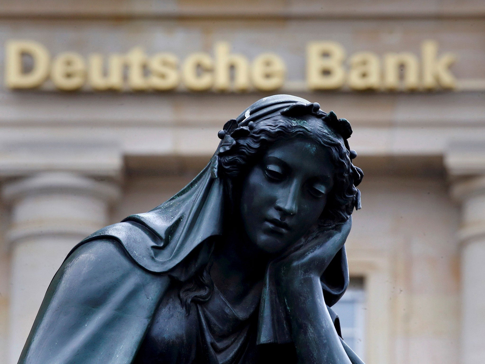 A statue outside the former headquarters of the German bank in Frankfurt