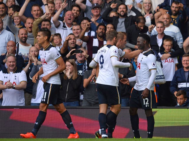 Wanyama celebrates with teammates after scoring his first goal of the season
