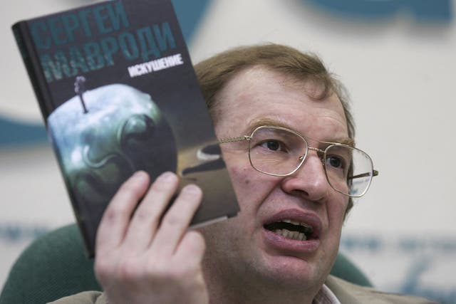 The founder of the MMM financial pyramid scheme Sergey Mavrodi, holding a copy of his banned book ‘Temptation’ in Moscow in May 2008. Mavrodi’s schemes stole life savings from more than a million Russians in the early 1990s
