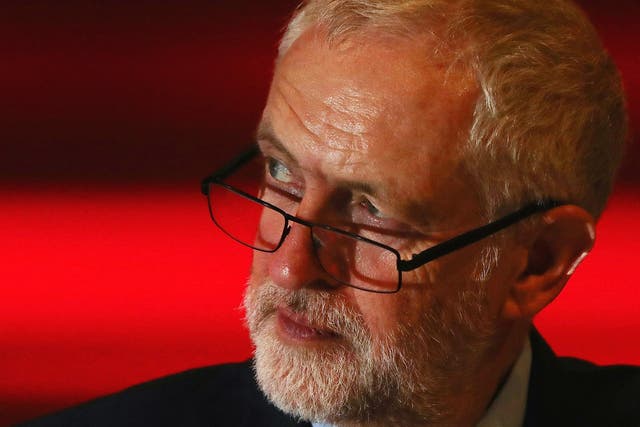 Jeremy Corbyn listens to a speaker on the third day of the Labour Party conference
