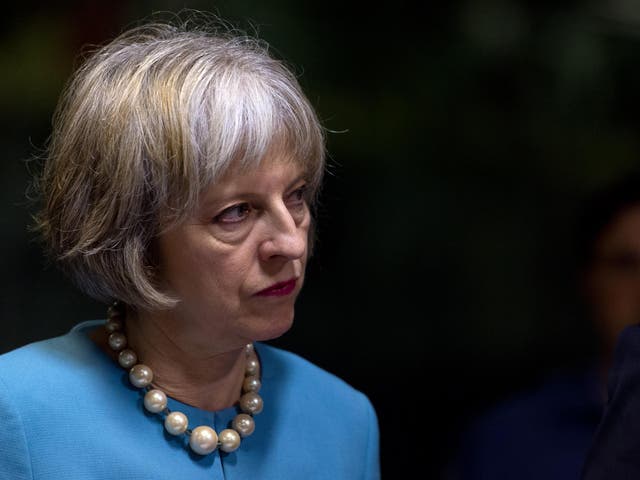 Ms May is accused of removing evidence supporting the free movement of people
