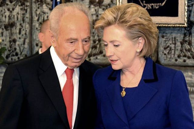 Former Israel President Shimon Peres, who died today, in a conference with then US Secretary of State Hilary Clinton in Israel in 2009