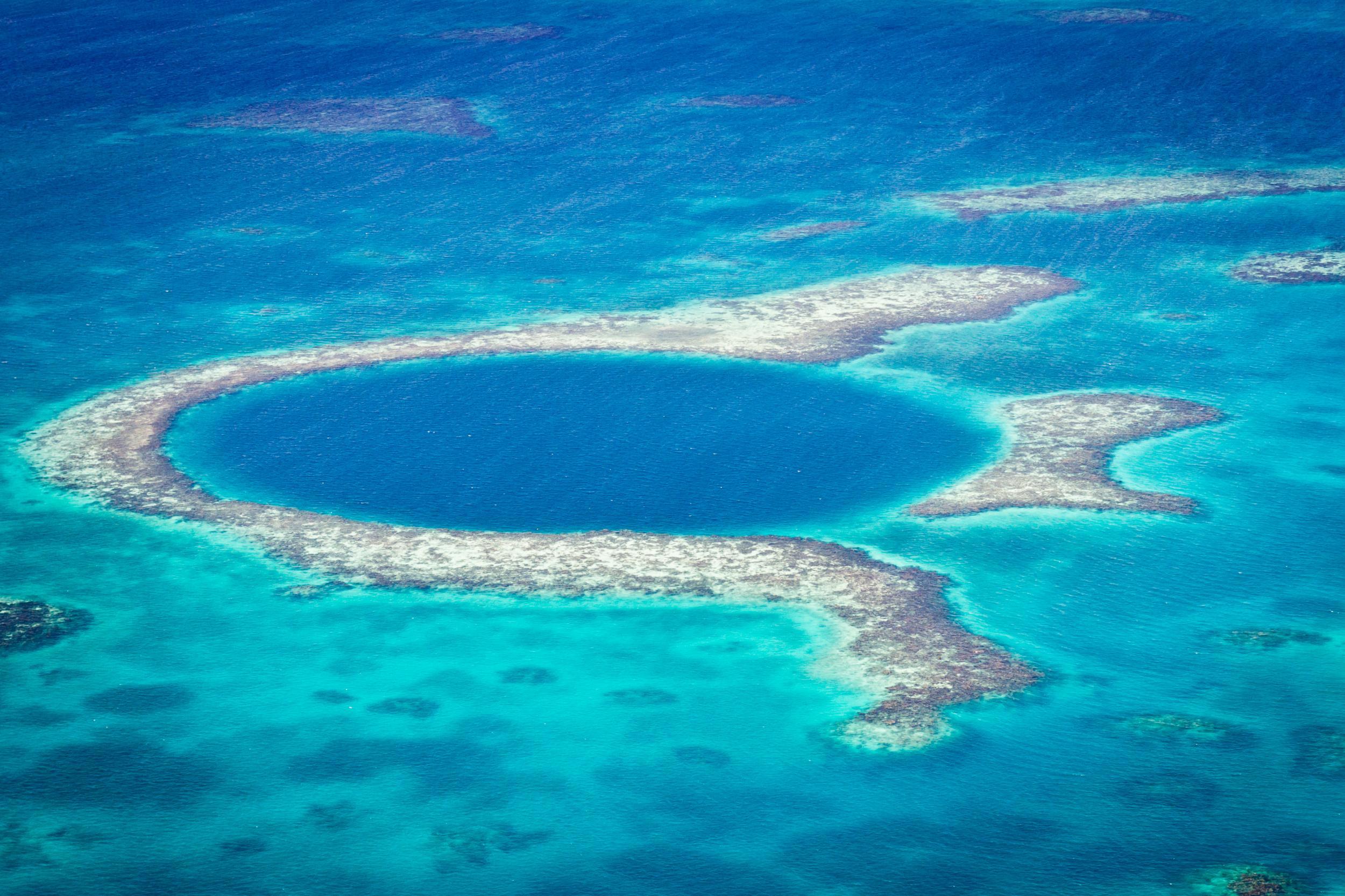 An aerial view of the Great Blue Hole off the coast of Belize