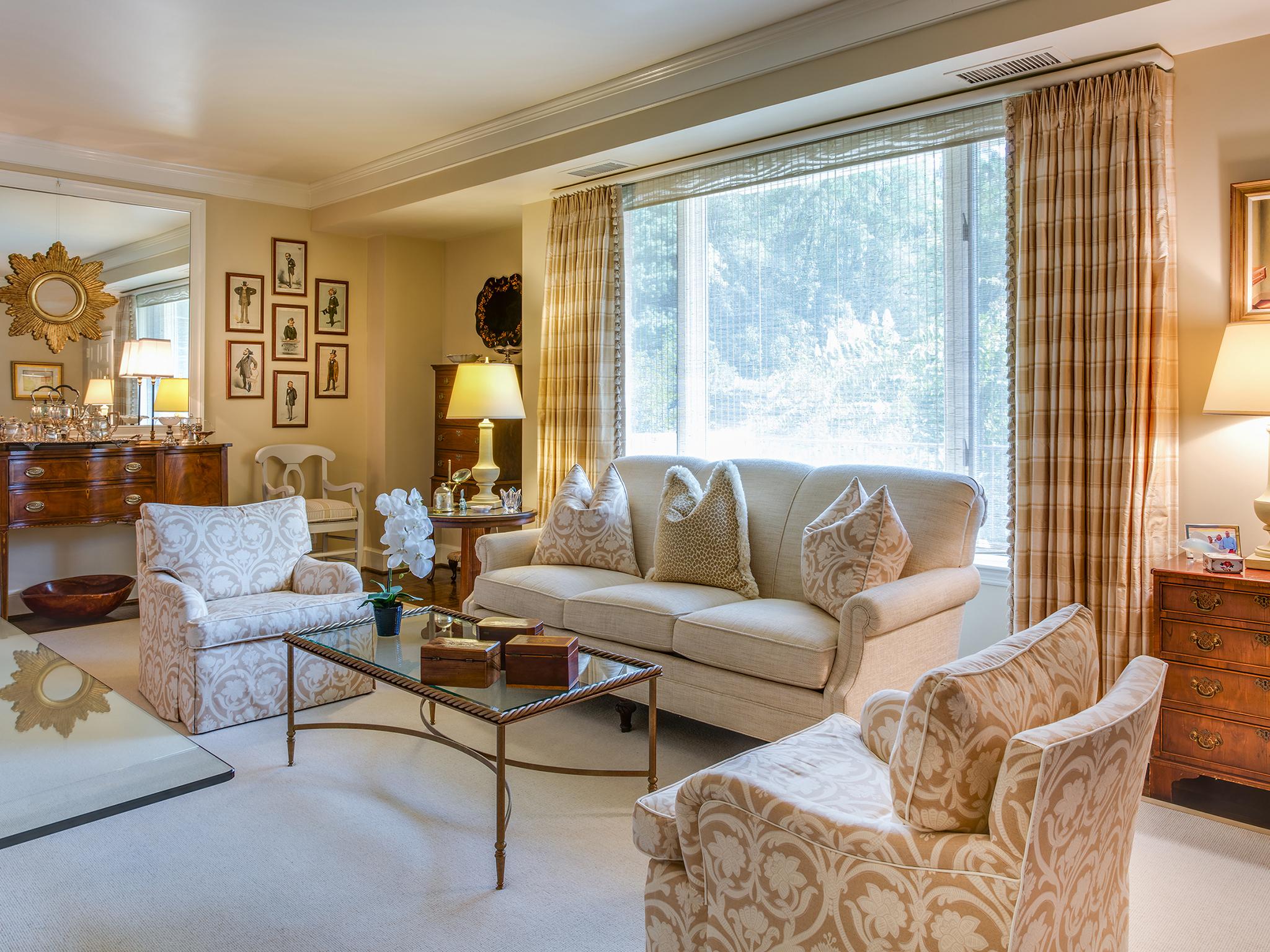 A fiord scene has pride of place in the condo of Barbara Freedman and Craig Lussi in Chevy Chase, Md. They use the space for relaxing and entertaining. Lussi was a winter Olympian. The table can be used as a sideboard or for dining (Washington Post)